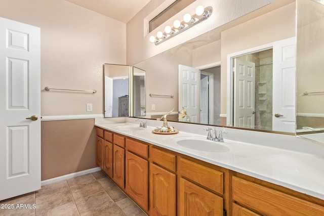 bathroom with tile patterned flooring and vanity