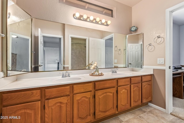 bathroom featuring vanity and tile patterned flooring