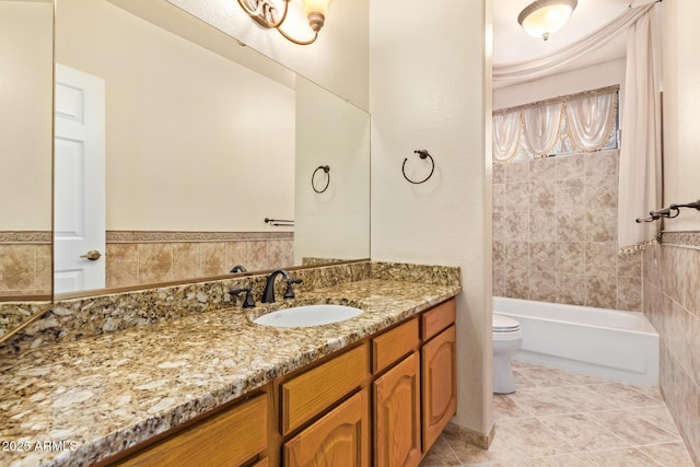 full bathroom with vanity, toilet, tiled shower / bath combo, and tile patterned flooring