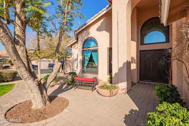 property entrance featuring a patio