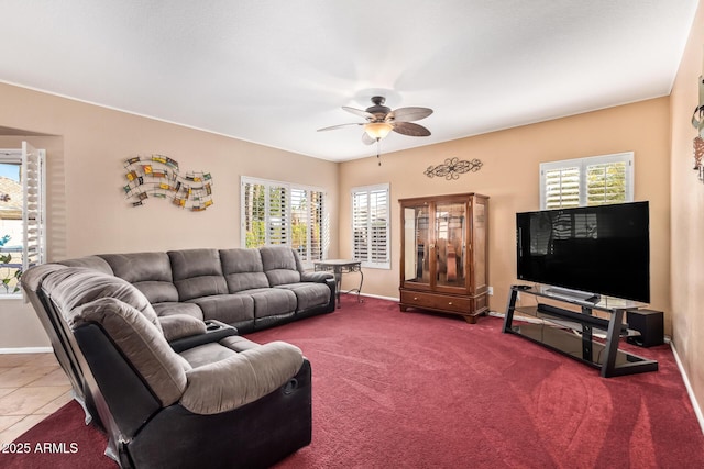 living room featuring ceiling fan and carpet