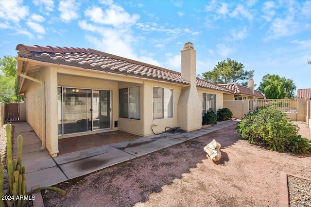 rear view of house with a patio