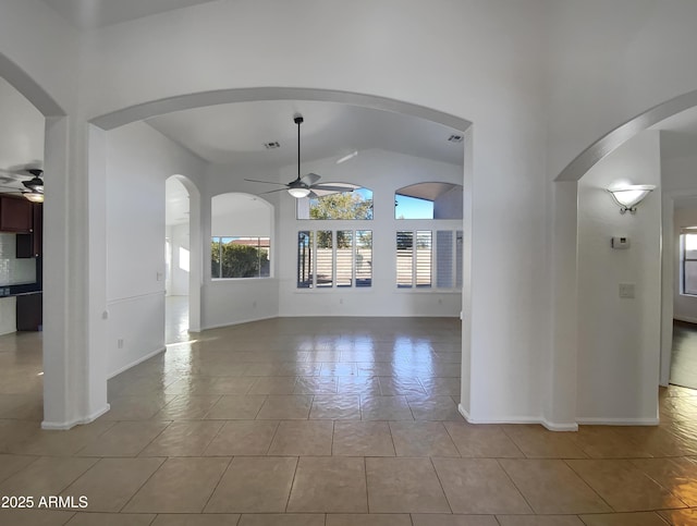 unfurnished living room featuring ceiling fan