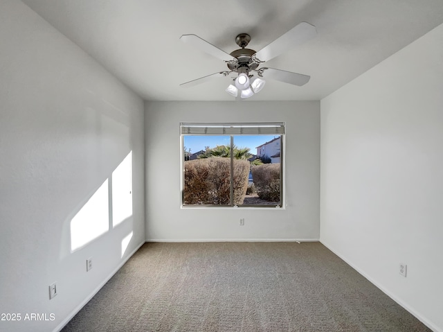 empty room featuring carpet floors and ceiling fan