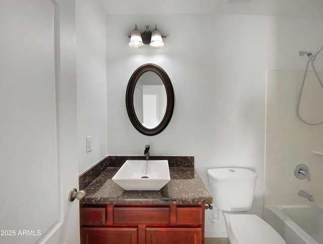 full bathroom featuring vanity, bathtub / shower combination, and toilet