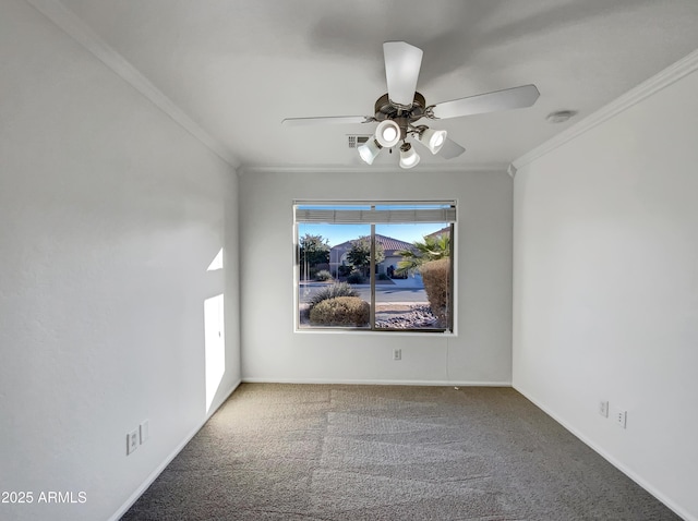 unfurnished room featuring ornamental molding, carpet flooring, and ceiling fan