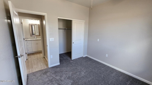 unfurnished bedroom featuring a closet and carpet floors