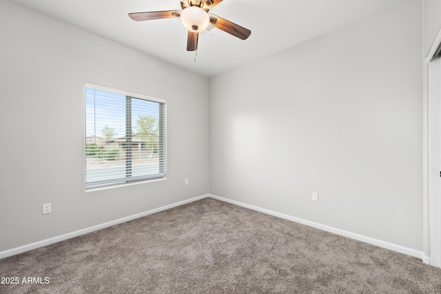 empty room featuring carpet flooring and ceiling fan