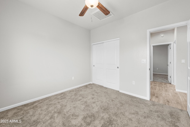 unfurnished bedroom with ceiling fan, a closet, and light carpet