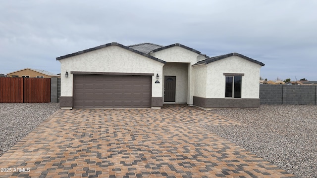 ranch-style home with a garage