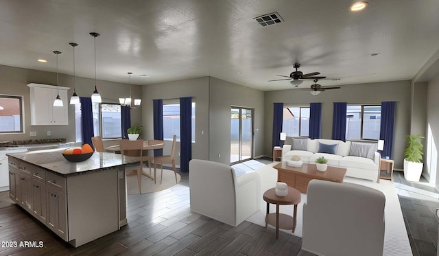 living room featuring dark hardwood / wood-style floors and a notable chandelier