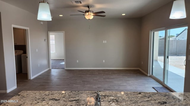 unfurnished living room with ceiling fan and hardwood / wood-style floors