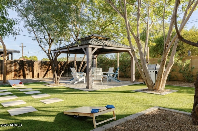 exterior space with a yard, a patio area, and a gazebo