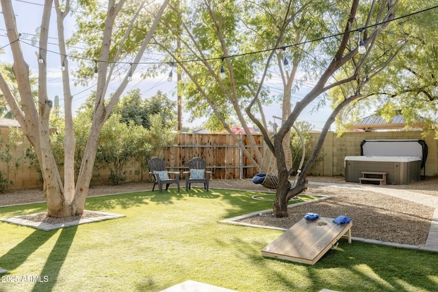 view of yard with a hot tub