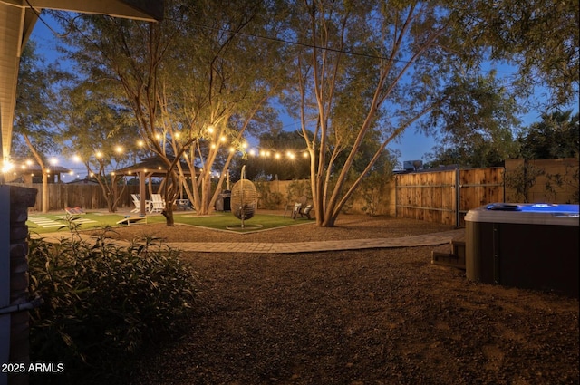 view of yard with a hot tub