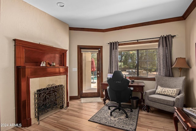 office area featuring ornamental molding and light wood-type flooring