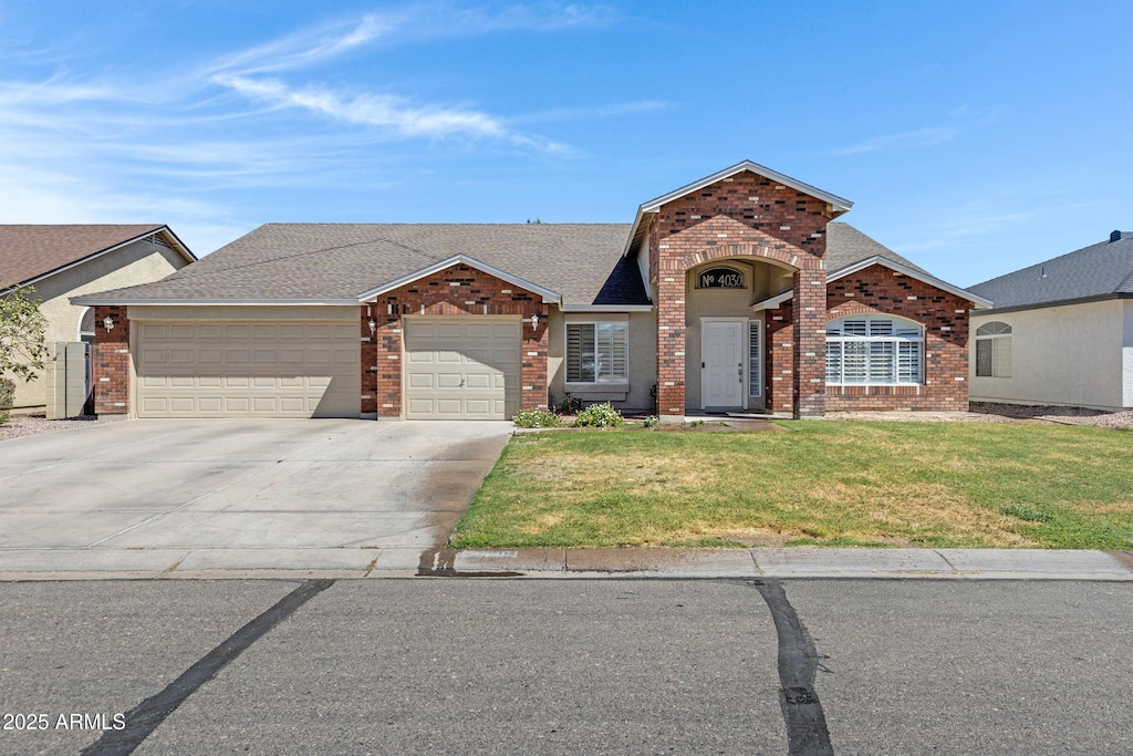 4030 E Meadow Creek Way, San Tan Valley, AZ 85140 - ranch-style home with brick siding, a garage, driveway, roof with shingles, and a front lawn