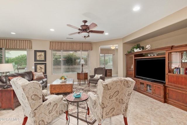 tiled living room featuring ceiling fan