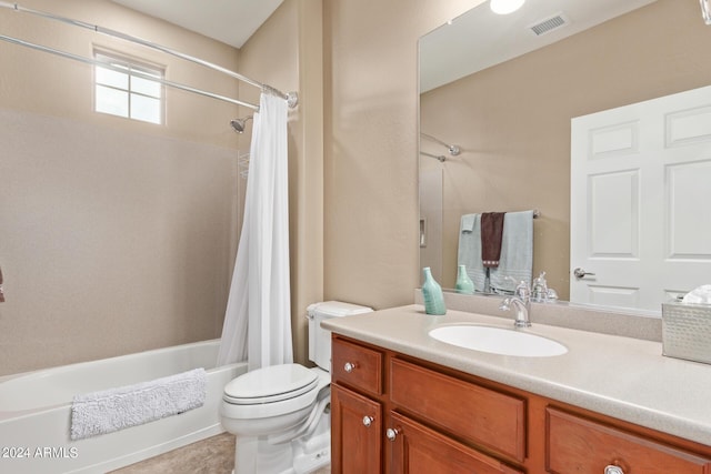 full bathroom with vanity, shower / tub combo, and toilet