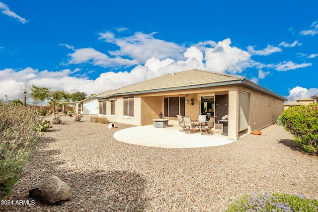 rear view of house with a patio