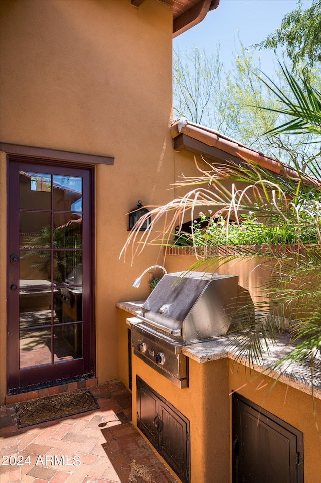 view of patio featuring a grill and exterior kitchen