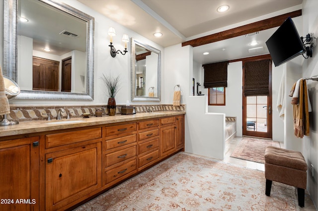 bathroom with tile patterned flooring and dual bowl vanity