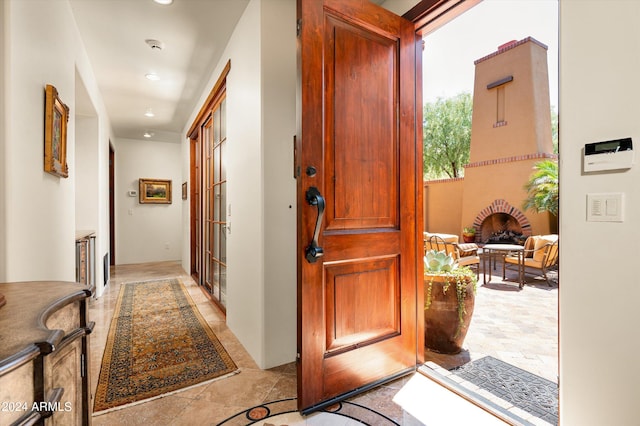 entrance foyer with light tile patterned floors