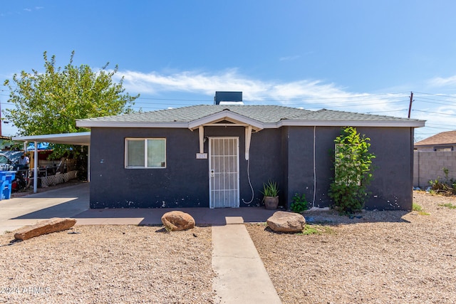 view of front of property with a carport