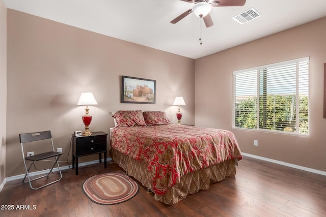 bedroom featuring dark hardwood / wood-style flooring and ceiling fan