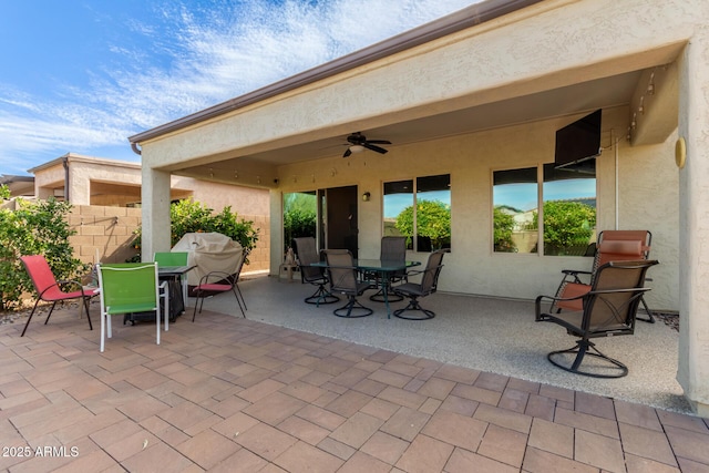 view of patio / terrace with a grill and ceiling fan