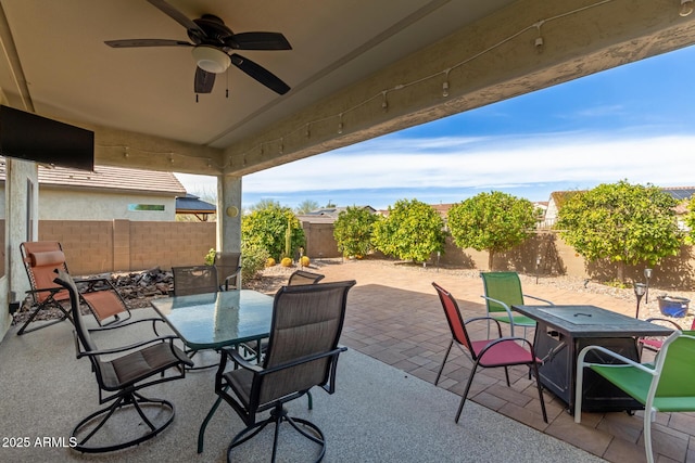 view of patio featuring ceiling fan