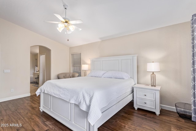 bedroom featuring ensuite bathroom, lofted ceiling, dark hardwood / wood-style floors, and ceiling fan