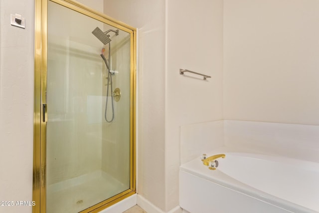 bathroom with separate shower and tub