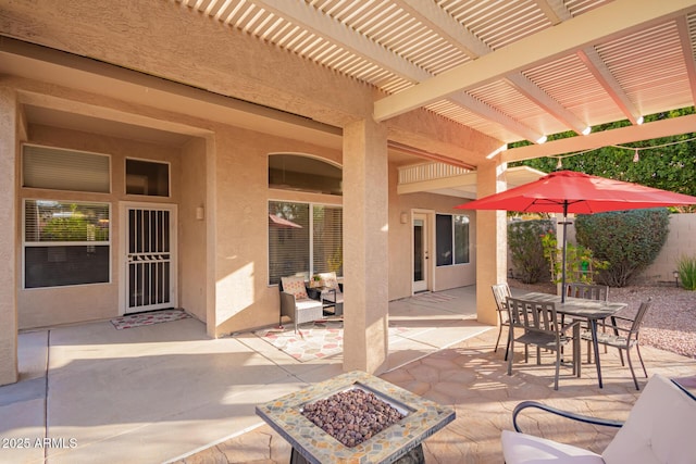 view of patio / terrace featuring a fire pit and a pergola