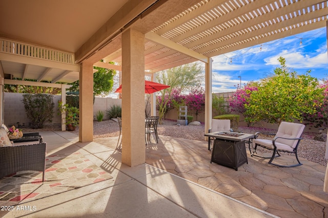 view of patio featuring an outdoor fire pit and a pergola