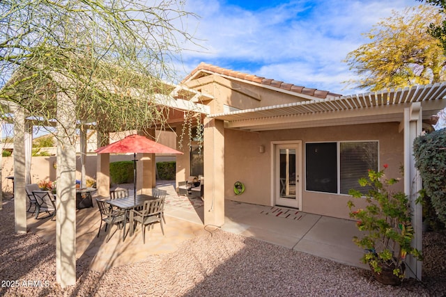 rear view of house featuring a patio area and a pergola