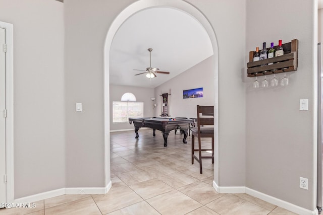 rec room with ceiling fan, pool table, lofted ceiling, and light tile patterned floors