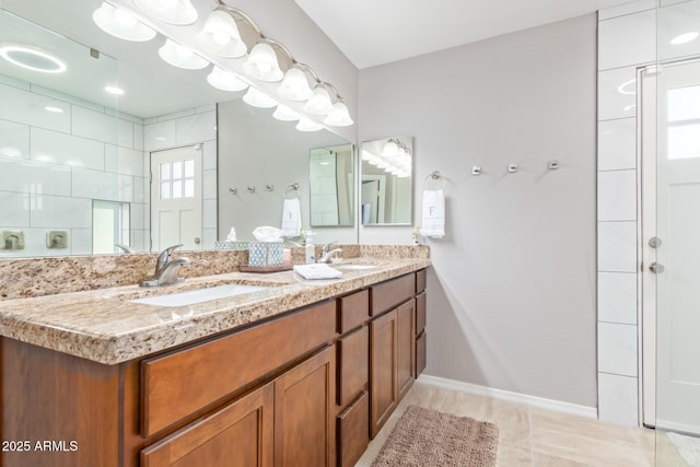 bathroom with vanity and a tile shower