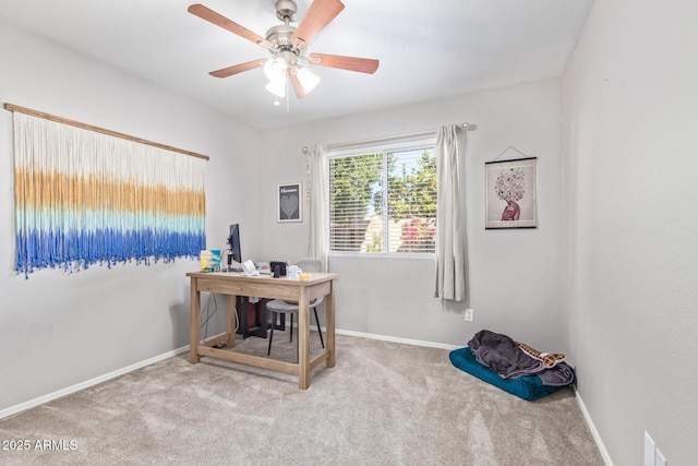 office with light carpet and ceiling fan