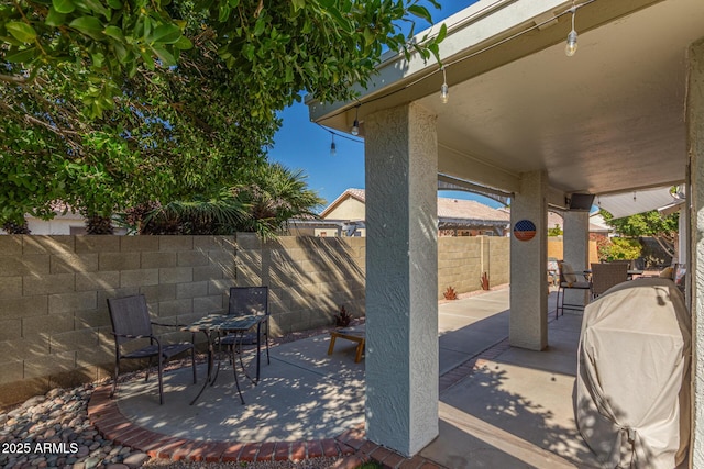 view of patio with a grill