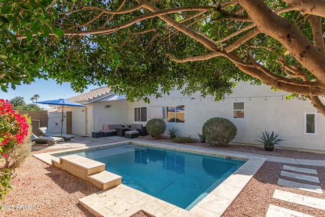 view of swimming pool with an outdoor living space