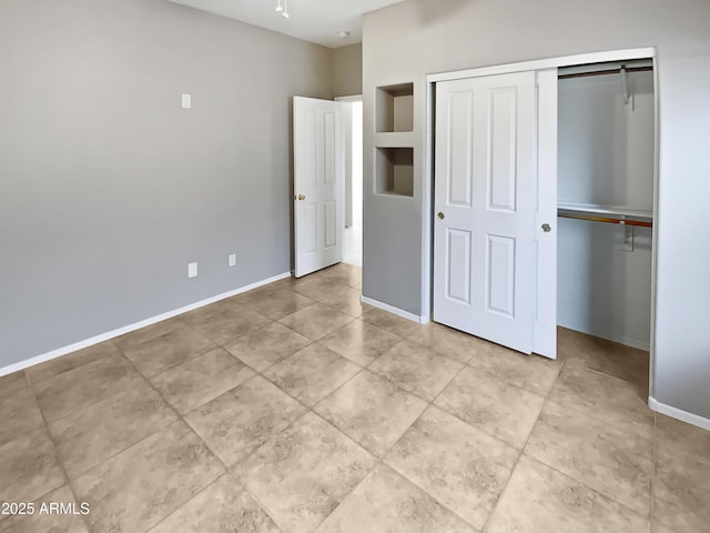 unfurnished bedroom featuring a closet