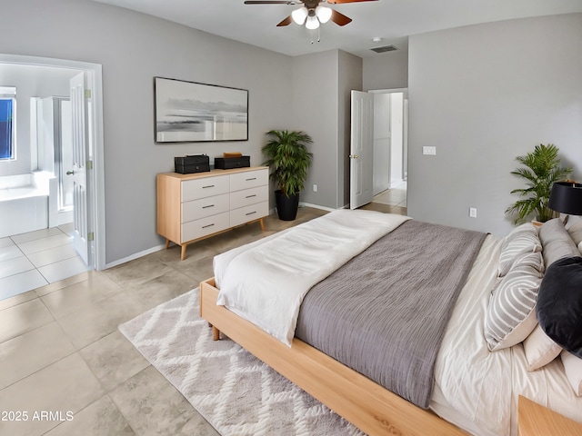 bedroom featuring ceiling fan, ensuite bathroom, and light tile patterned floors