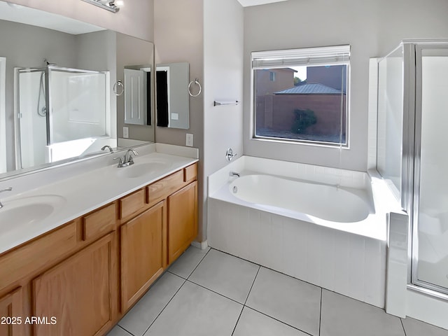 bathroom with independent shower and bath, vanity, and tile patterned floors