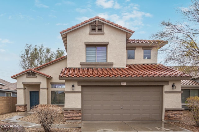 mediterranean / spanish-style home with stone siding, concrete driveway, fence, and stucco siding