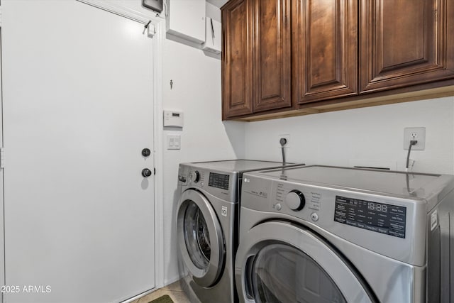 laundry area featuring cabinets and independent washer and dryer