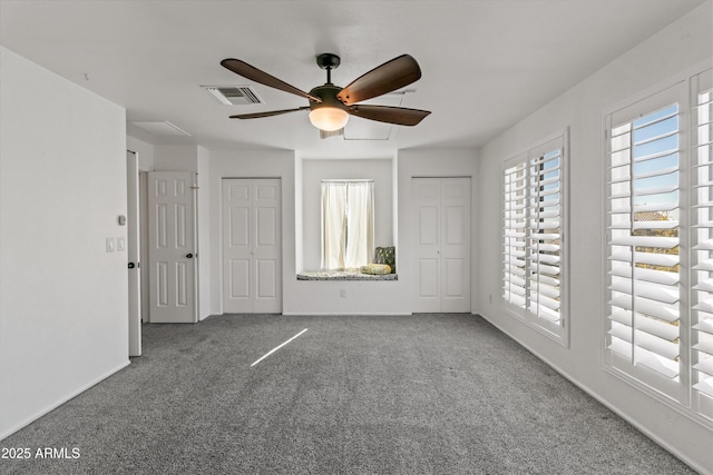 unfurnished bedroom featuring ceiling fan and carpet flooring