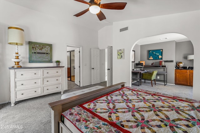 bedroom featuring lofted ceiling, light colored carpet, and ceiling fan