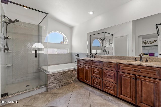 bathroom featuring independent shower and bath, vanity, and tile patterned floors