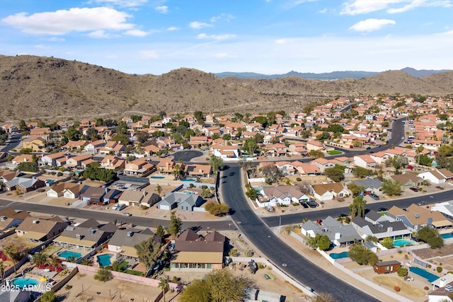 drone / aerial view featuring a mountain view